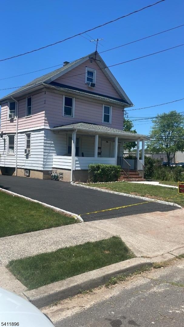54 Gaston Avenue, Unit 2 Raritan, NJ 08869 - Photo 1 of 16 a front view of a house with a yard