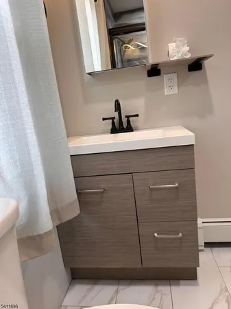 a bathroom with a sink and mirror