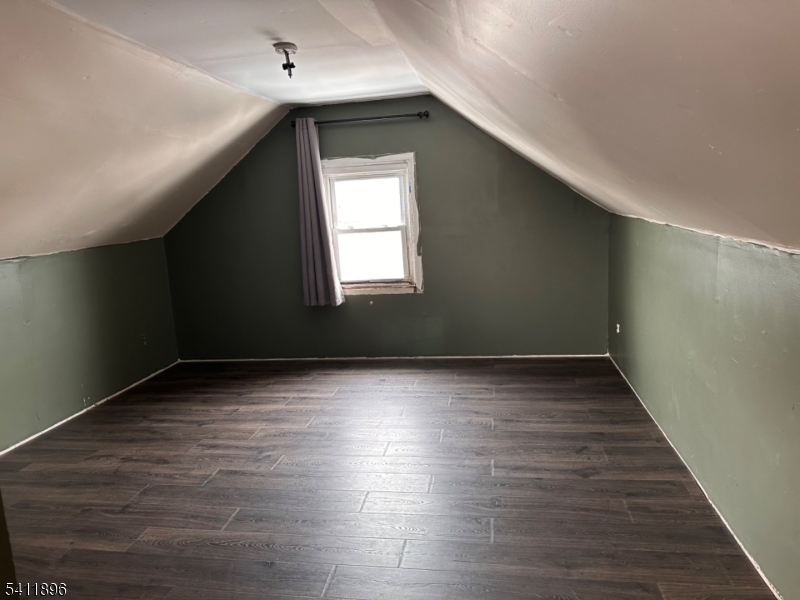 54 Gaston Avenue, Unit 2 Raritan, NJ 08869 - Photo 16 of 16 a view of an empty room with wooden floor and a window