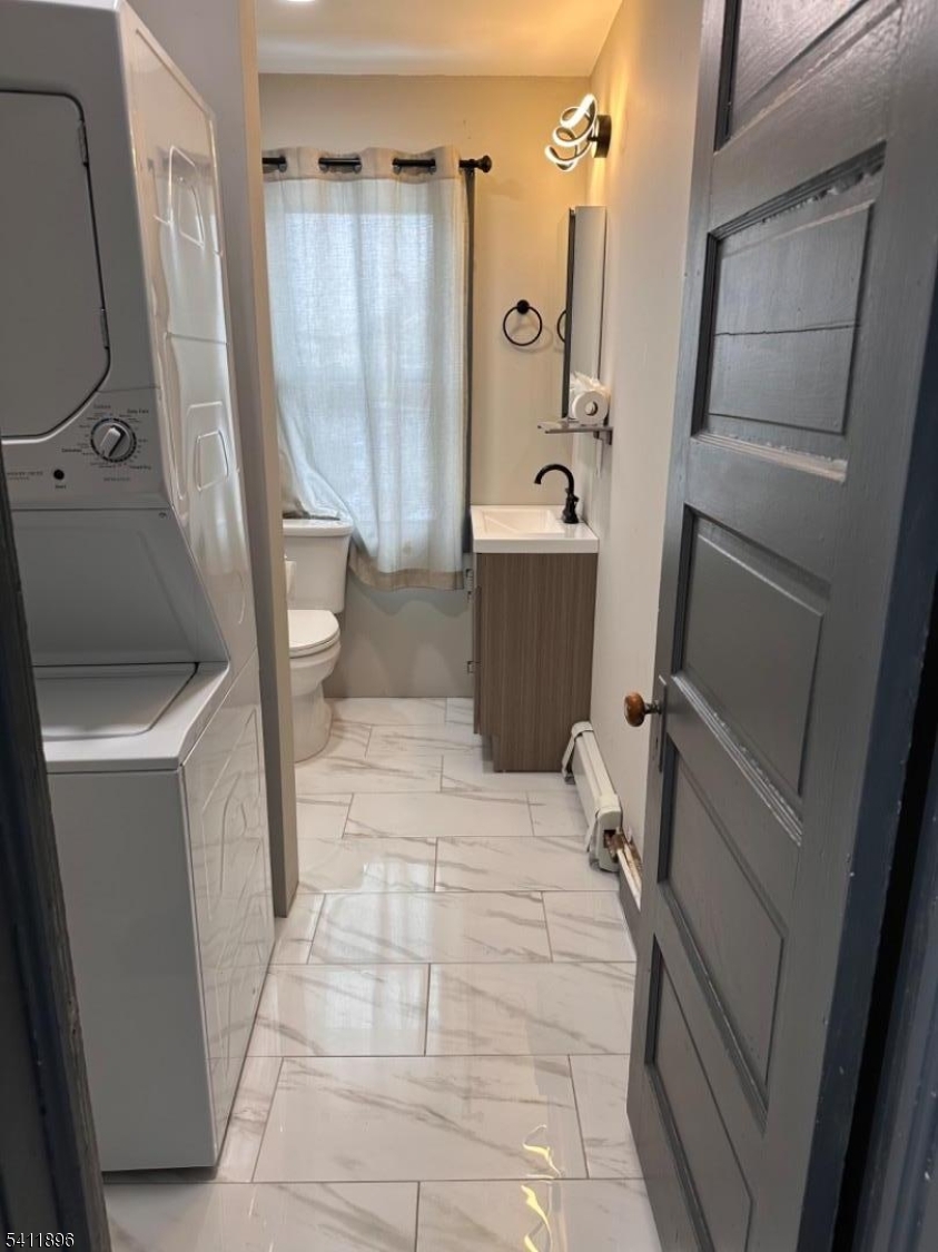 54 Gaston Avenue, Unit 2 Raritan, NJ 08869 - Photo 7 of 16 a bathroom with a tub a sink a mirror and a shower