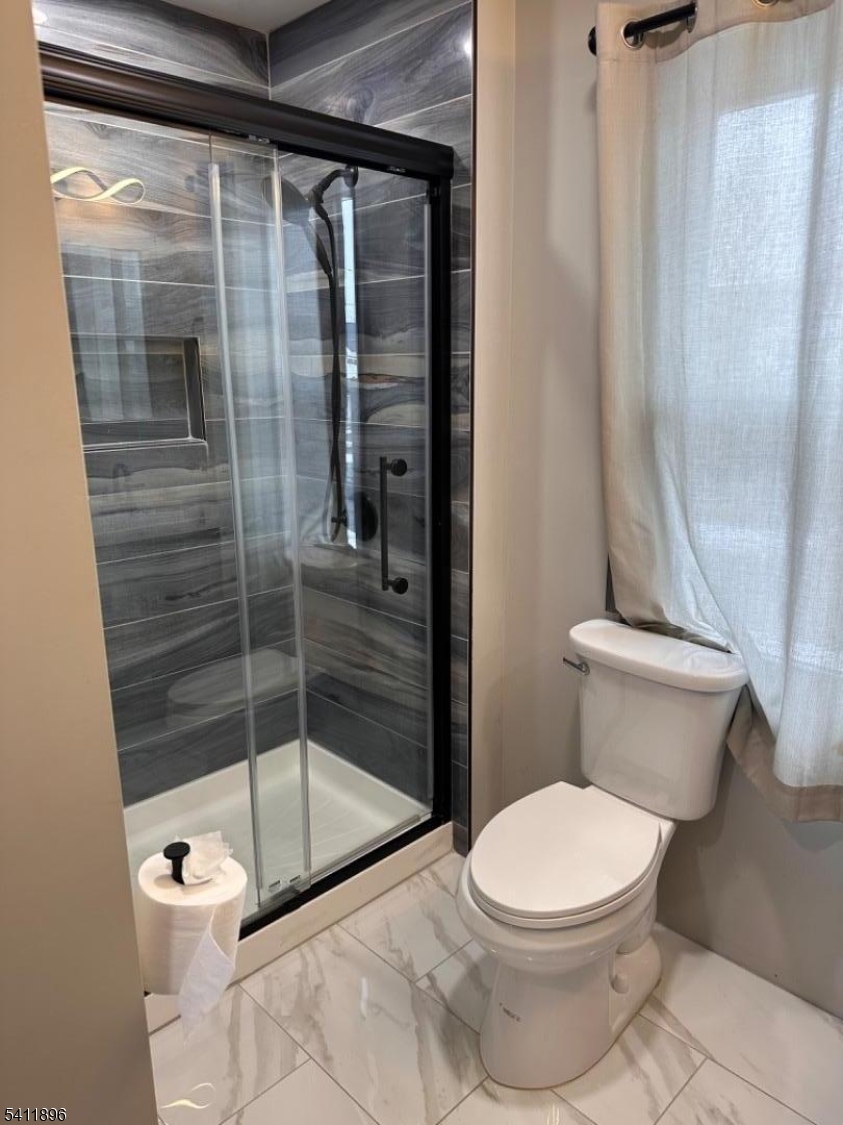 54 Gaston Avenue, Unit 2 Raritan, NJ 08869 - Photo 9 of 16 a bathroom with a toilet and a shower