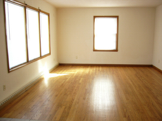 2000 North Alpine Road Rockford, IL 61107 - Photo 4 of 13 a view of an empty room wooden floor and a window