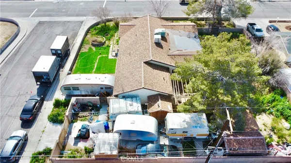 an aerial view of houses with outdoor space