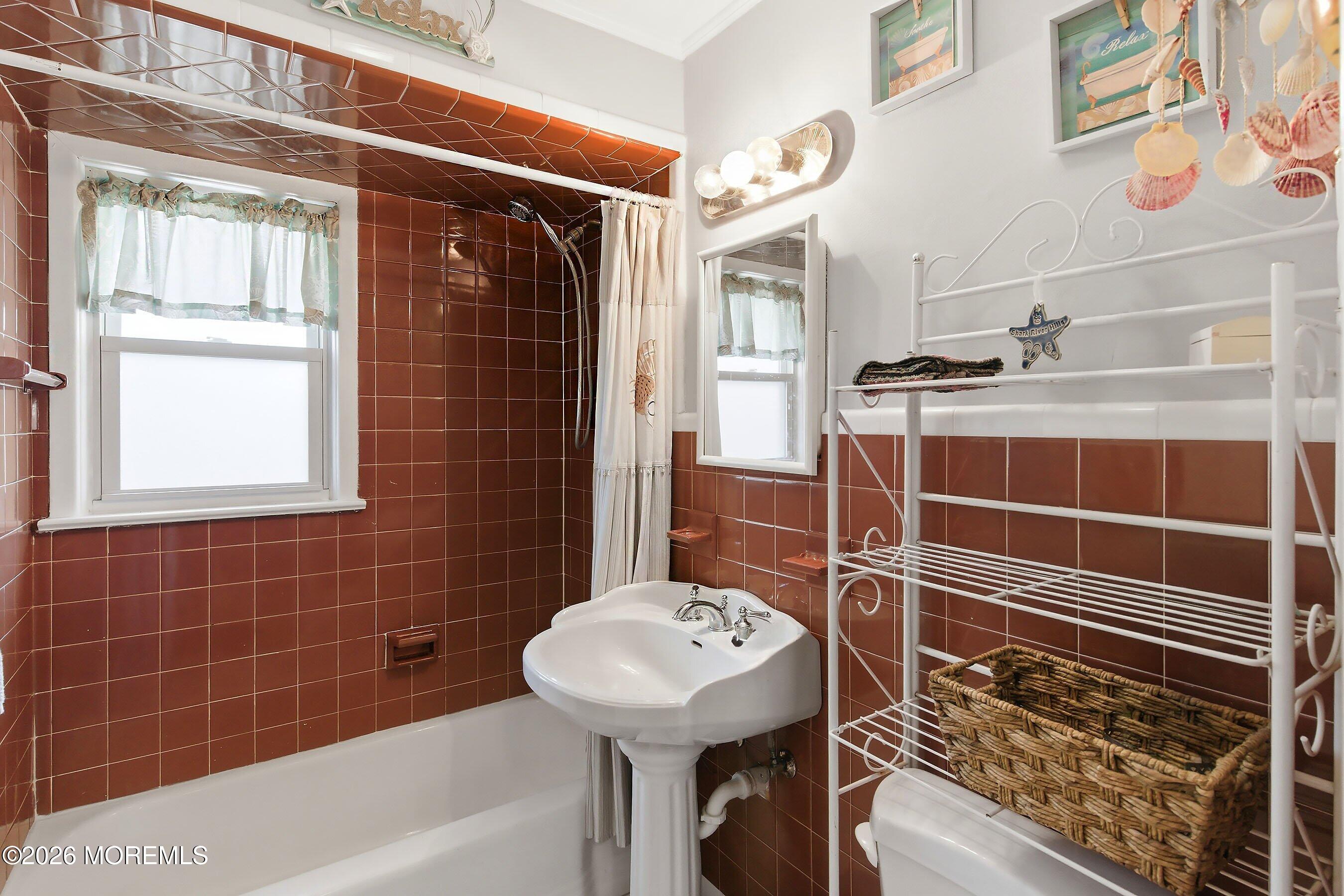 412 Moore Road Neptune Township, NJ 07753 - Photo 12 of 36 a bathroom with a sink toilet and shower
