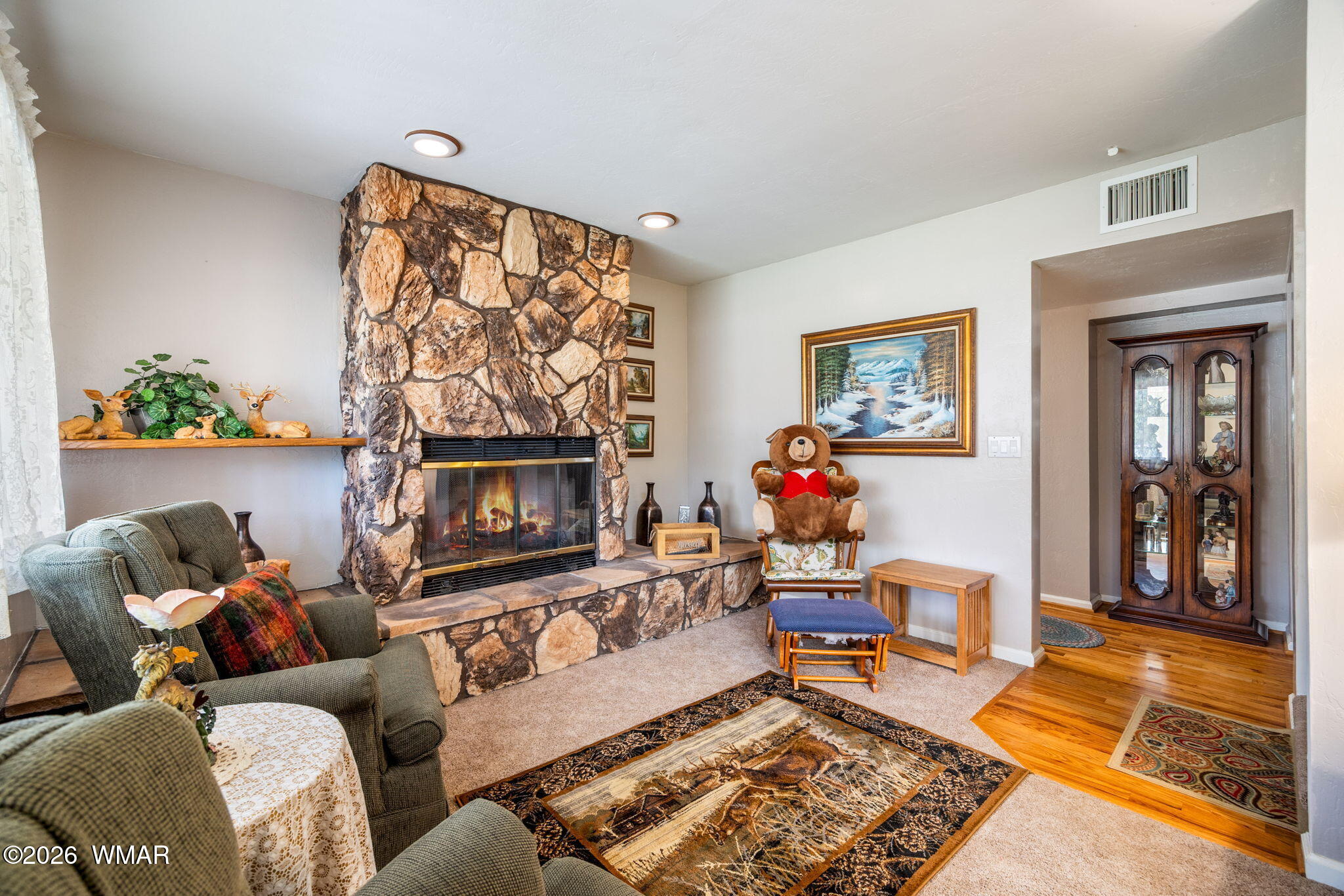 2922 Pine Rim Road Overgaard, AZ 85933 - Photo 10 of 58 a living room with furniture and a fireplace
