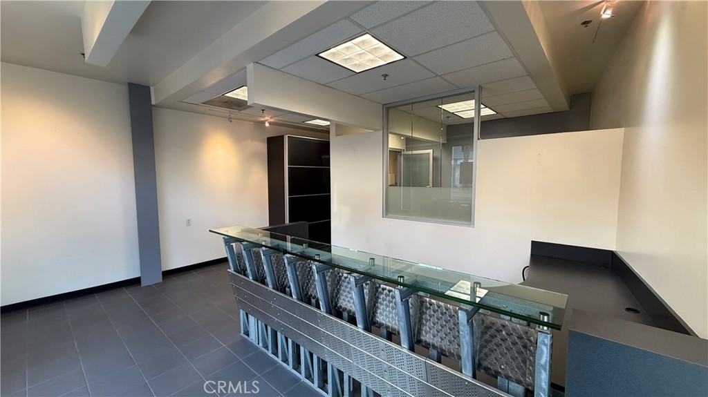 24691 Del Prado Avenue, Unit 100 Dana Point, CA 92629 - Photo 29 of 31 wooden floor in an empty room