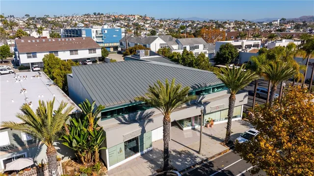 a view of a house with a swimming pool and sitting space