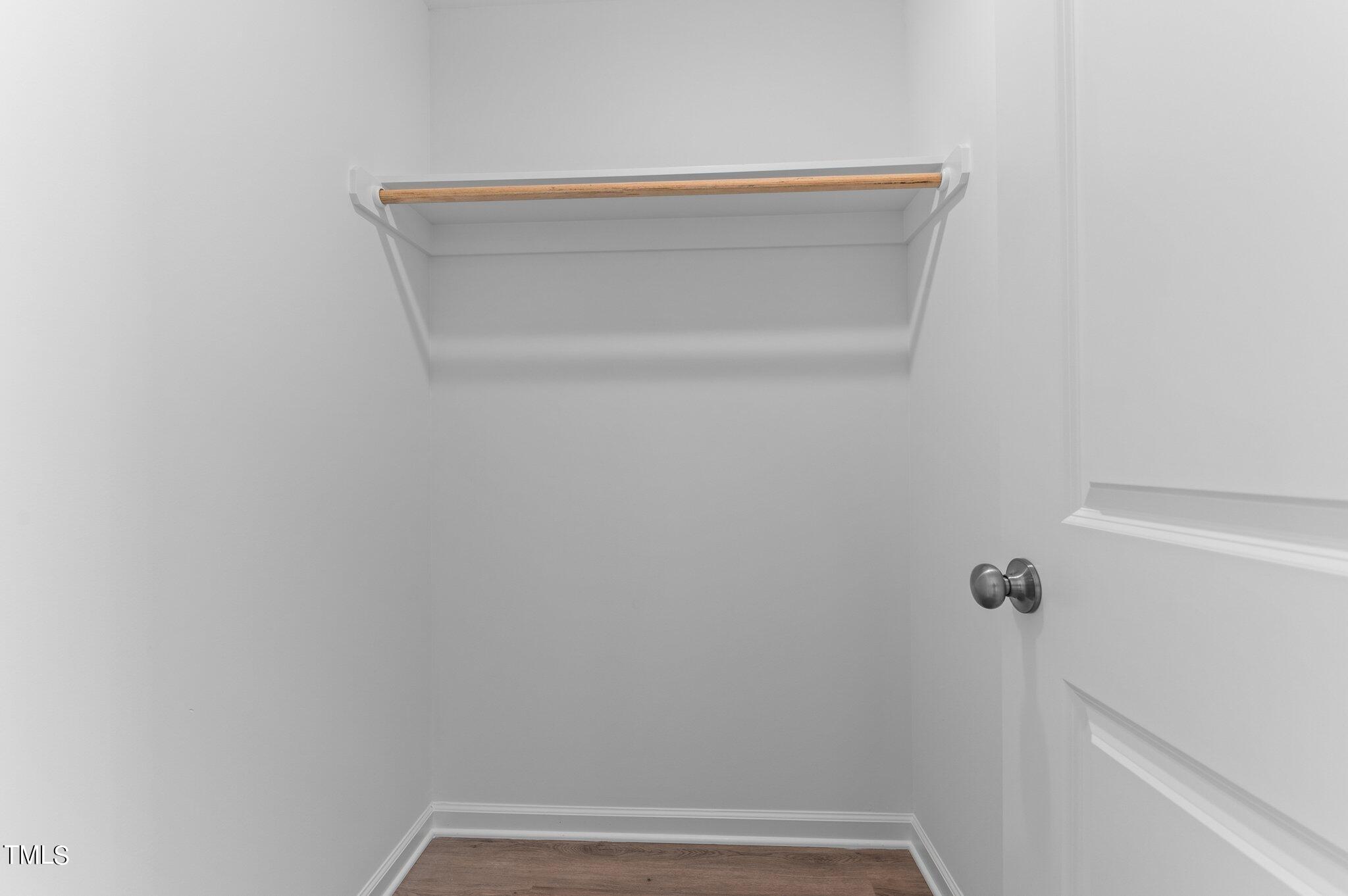 207 South Nash Street, Unit AB Bunn, NC 27508 - Photo 12 of 25 a view of small space with racks on the wall