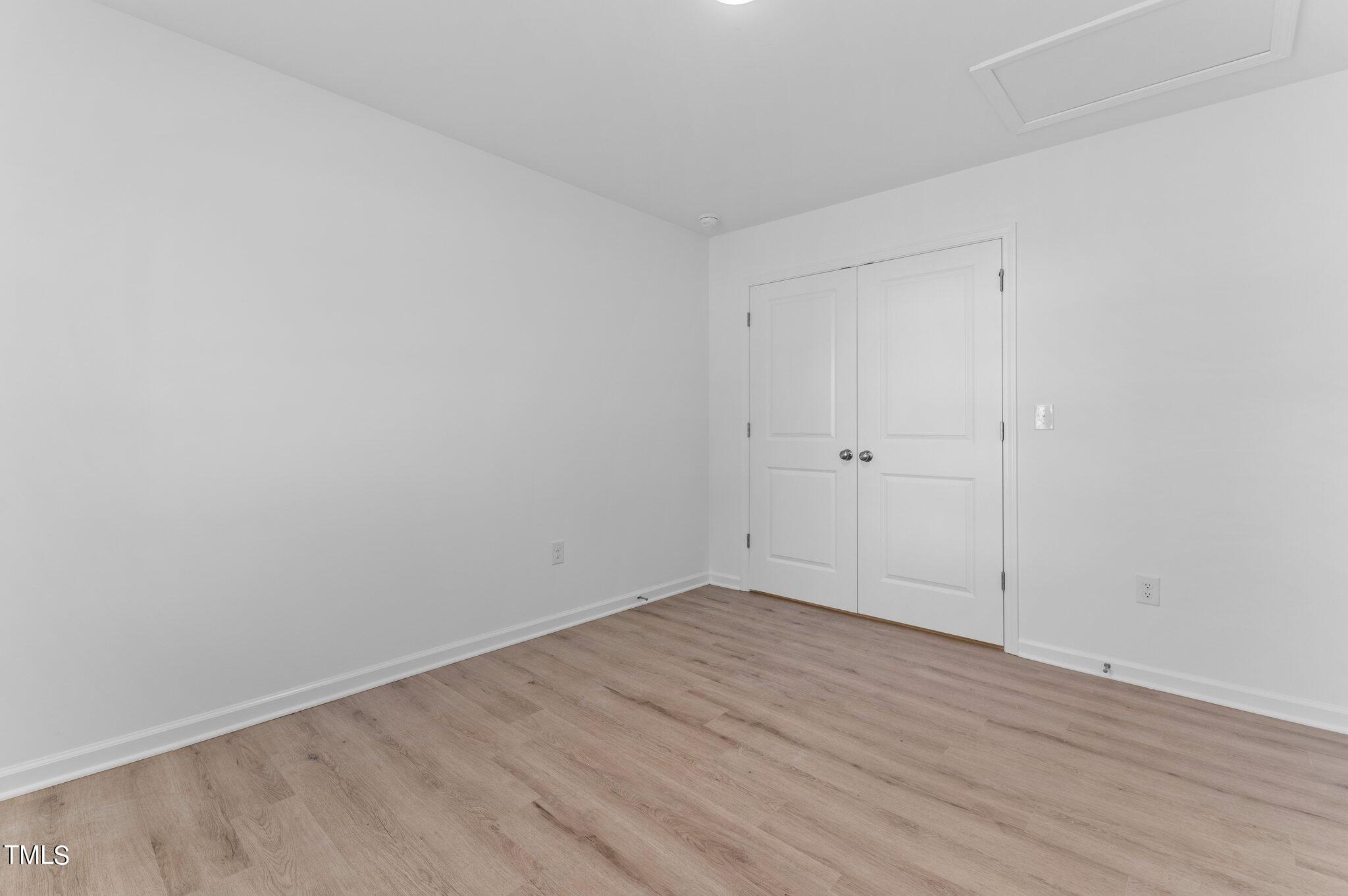 207 South Nash Street, Unit AB Bunn, NC 27508 - Photo 15 of 25 wooden floor in an empty room