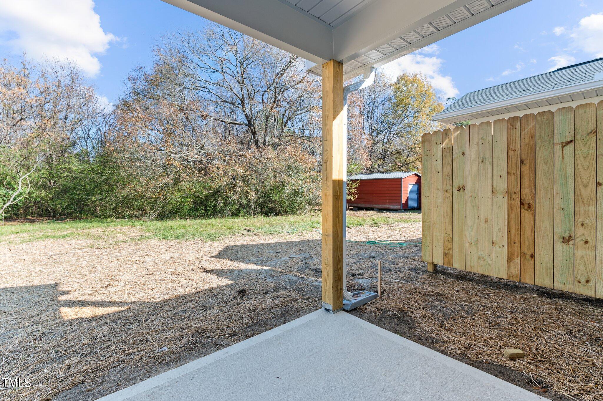 207 South Nash Street, Unit AB Bunn, NC 27508 - Photo 18 of 25 a view of a house with backyard