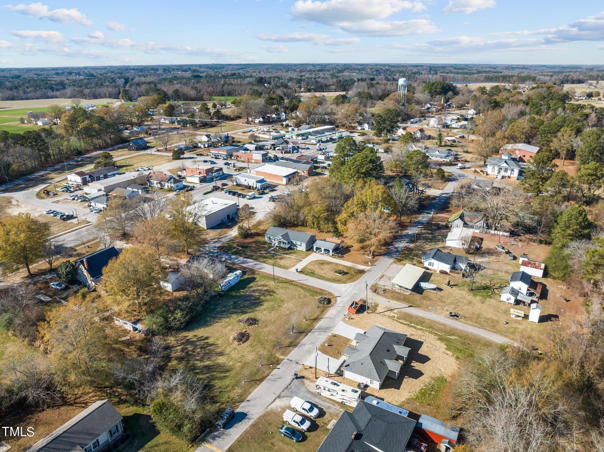 207 South Nash Street, Unit AB Bunn, NC 27508 - Photo 23 of 25 an aerial view of residential building with parking space
