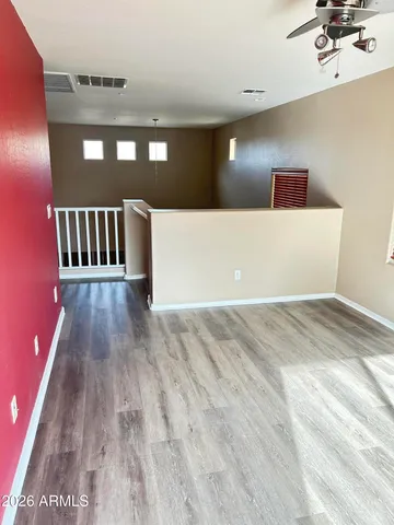 a view of a hallway with stairs