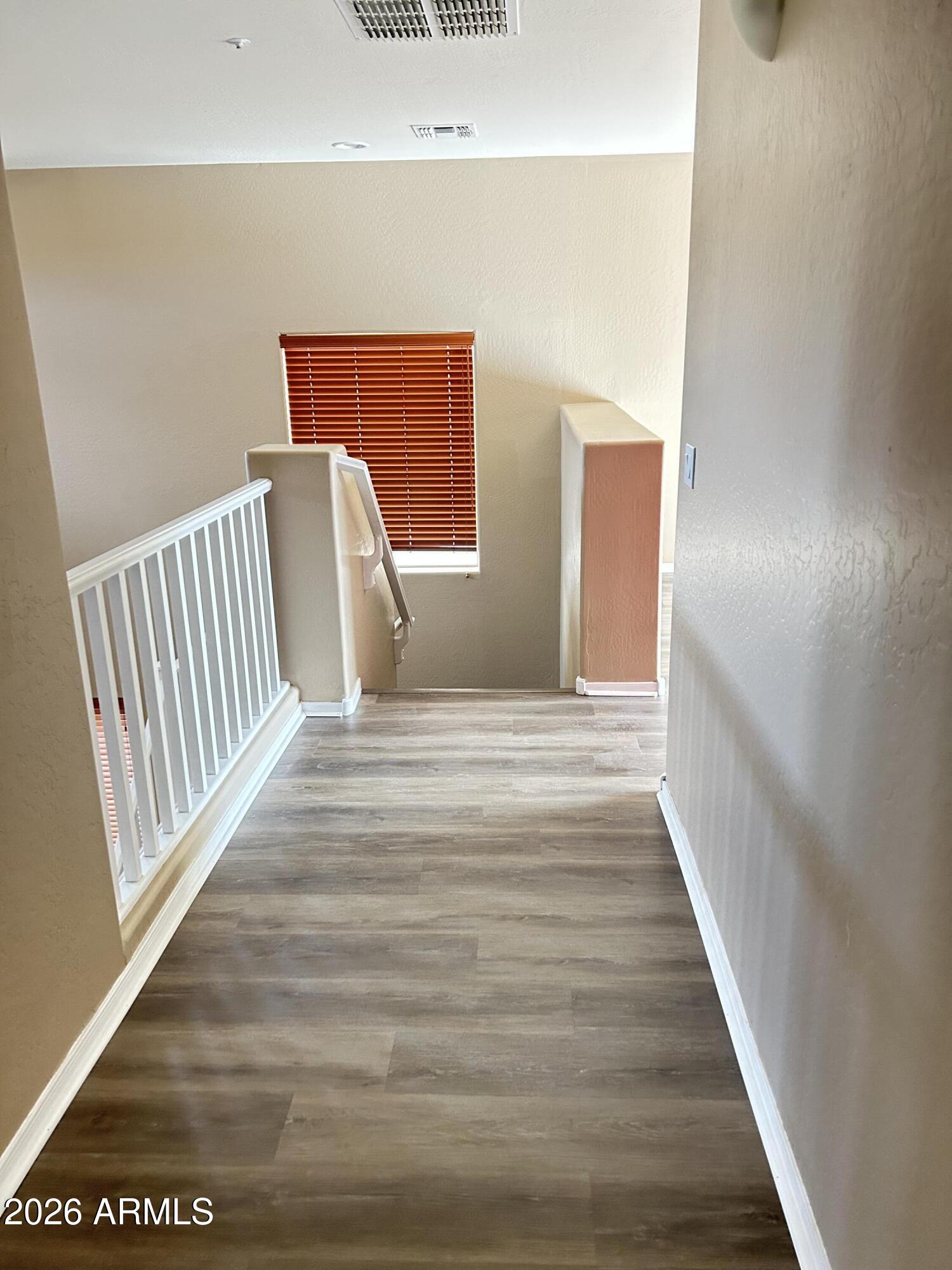 7089 West Eagle Ridge Lane Peoria, AZ 85383 - Photo 17 of 27 a view of a hallway view with staircase