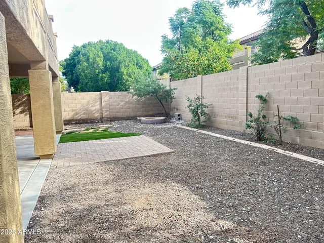 a backyard of a house with lots of green space