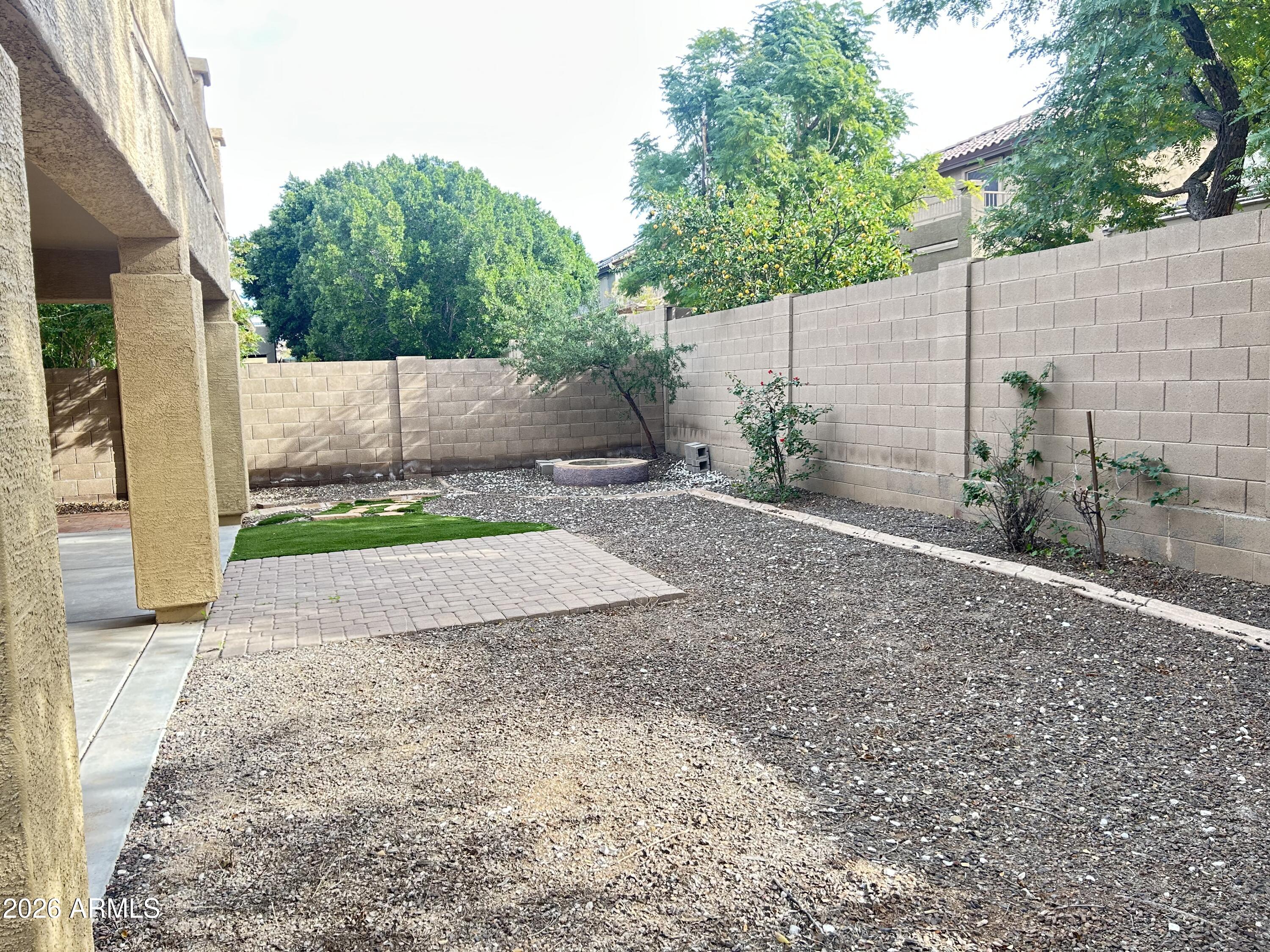 7089 West Eagle Ridge Lane Peoria, AZ 85383 - Photo 6 of 27 a backyard of a house with lots of green space
