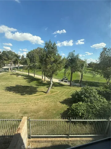 a view of a golf course with a lake view