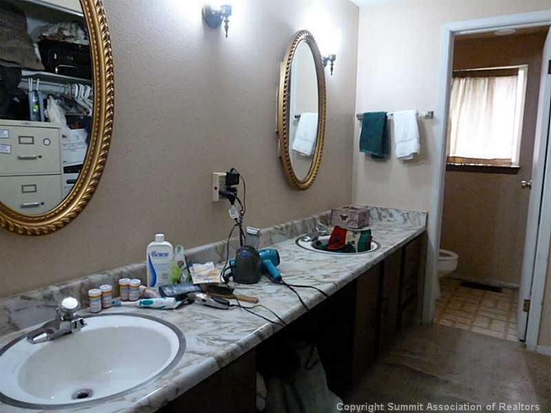 461 Alpine Road Dillon, CO 80435 - Photo 11 of 13 a bathroom with a granite countertop sink a mirror and vanity