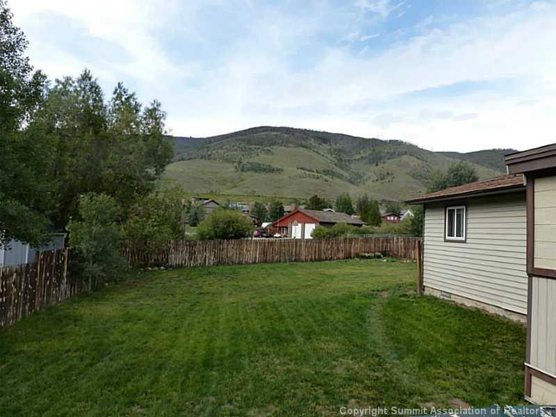 461 Alpine Road Dillon, CO 80435 - Photo 13 of 13 a view of a backyard with plants and large trees