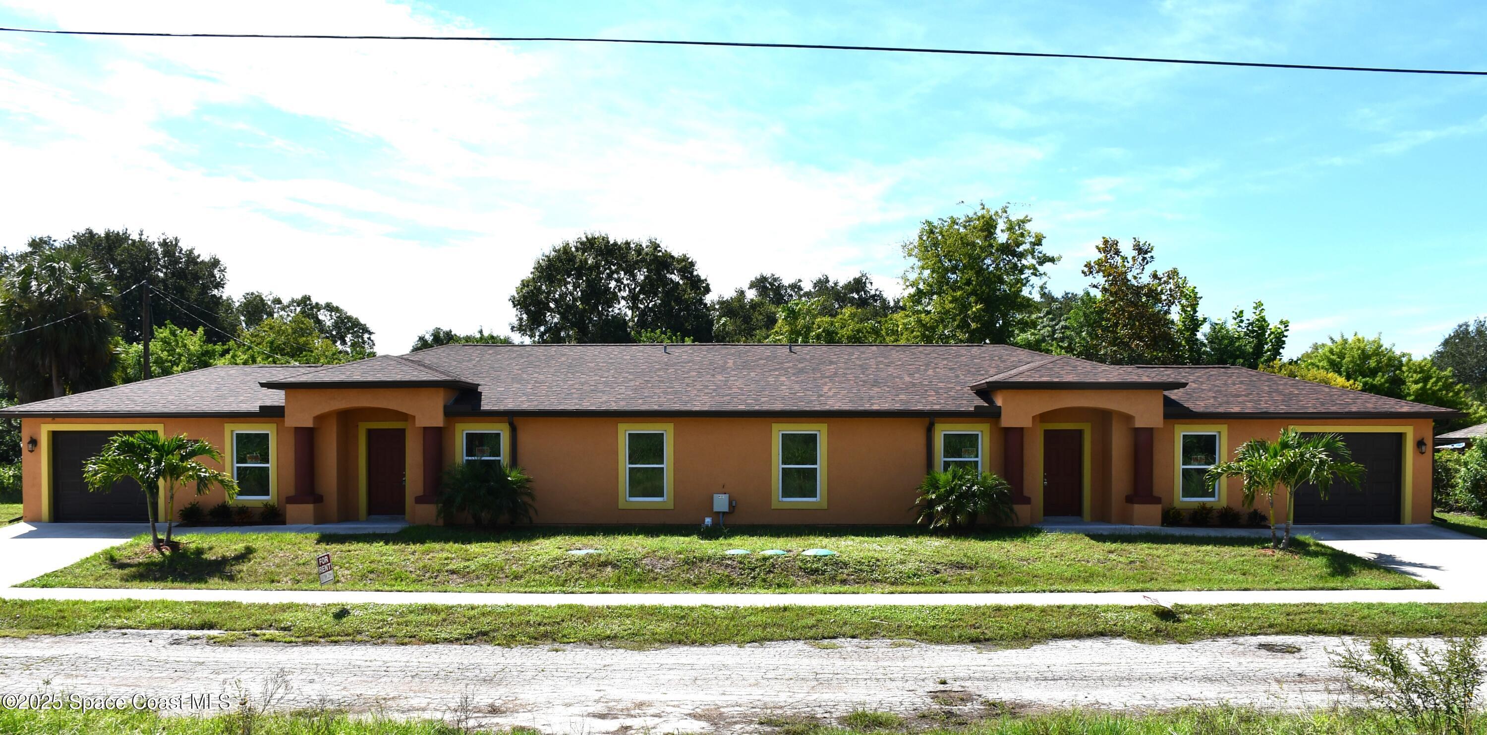 1465 Furnari Street Cocoa, FL 32922 - Photo 4 of 5 a view of a yard in front of a house