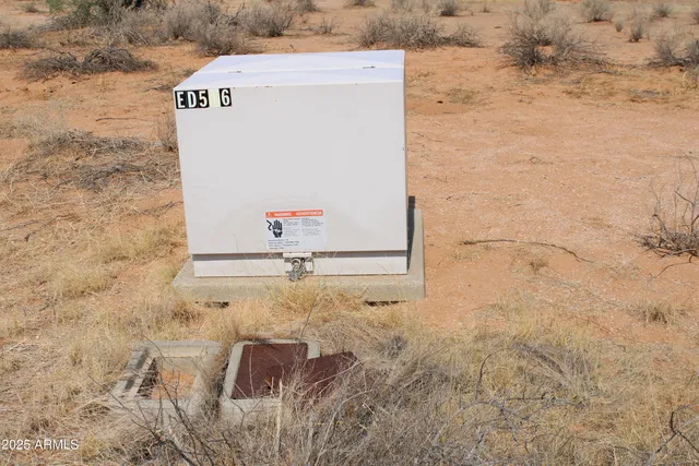 a view of mountain with sunset in background
