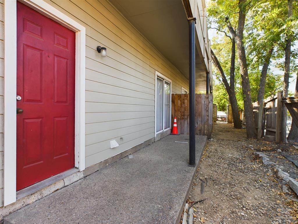 2313 Longview Street, Unit 102 Austin, TX 78705 - Photo 12 of 14 a view of a house with a door and wooden fence