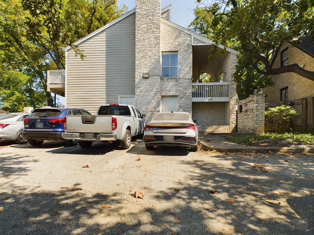 2313 Longview Street, Unit 102 Austin, TX 78705 - Photo 14 of 14 a view of a car park in front of house