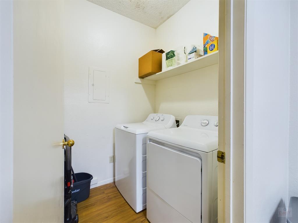 2313 Longview Street, Unit 102 Austin, TX 78705 - Photo 6 of 14 a utility room with dryer and washer
