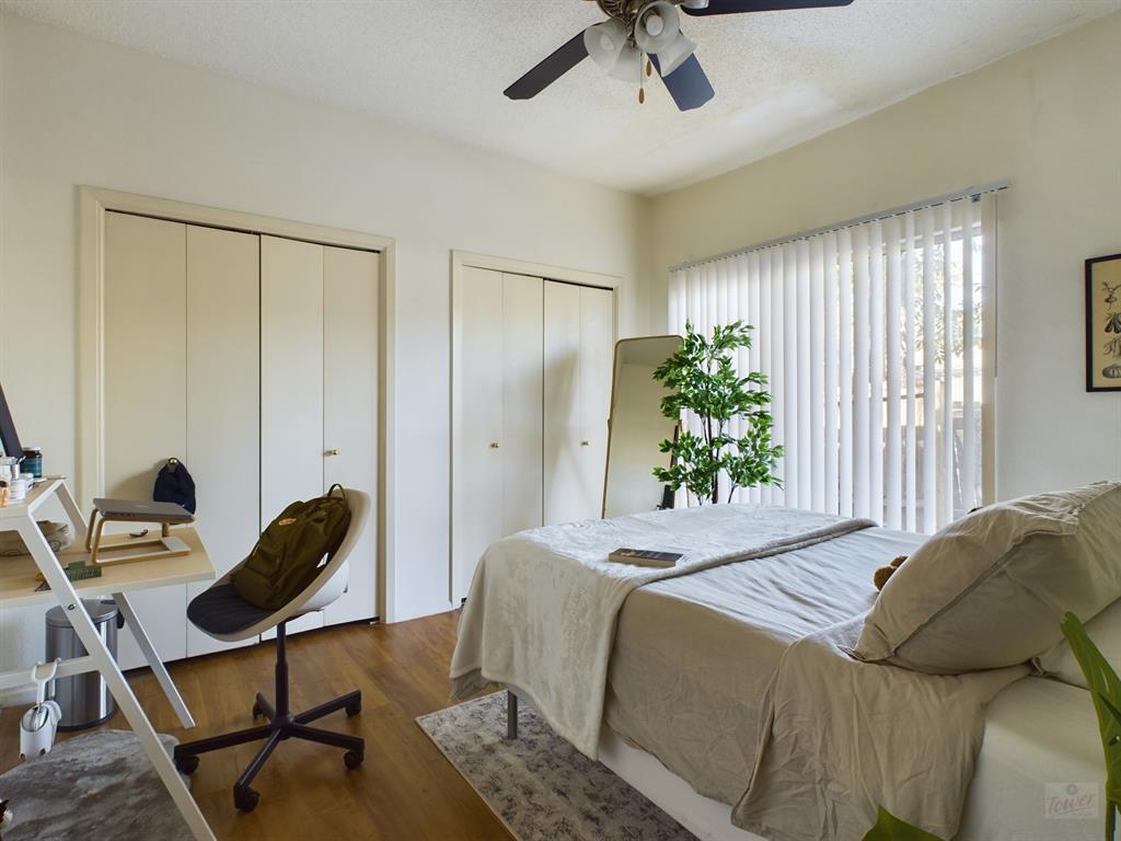 2313 Longview Street, Unit 102 Austin, TX 78705 - Photo 10 of 14 a bedroom with a bed and a window