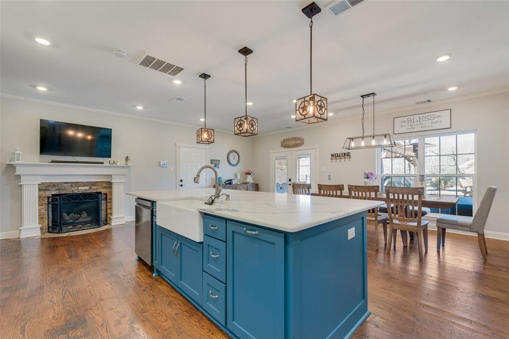 669 VZ County Road Canton, TX 75103 - Photo 15 of 40 Working propane fireplace in the kitchen. Decorative lighting.