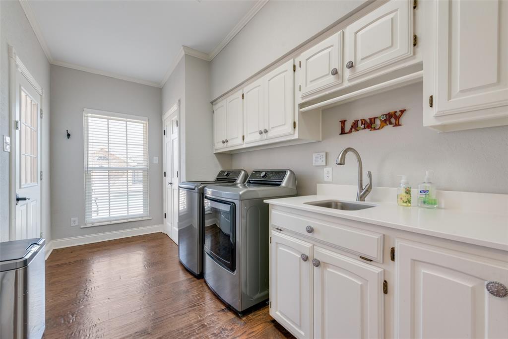 669 VZ County Road Canton, TX 75103 - Photo 20 of 40 Large laundry room with sink. Also has an additional storage closet and lots of cabinetry.