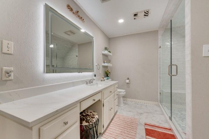 669 VZ County Road Canton, TX 75103 - Photo 28 of 40 Recent remodel of the secondary upstairs bathroom with beautiful granite counter tops, lighted mirror and huge shower.