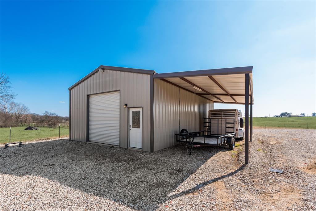669 VZ County Road Canton, TX 75103 - Photo 39 of 40 25x40 metal shop building with 12x40 overhang for parking your equipment.