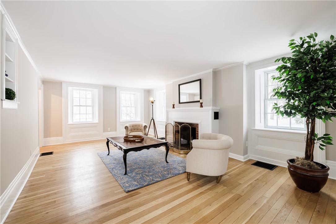 7834 N Road Victor, NY 14564 - Photo 17 of 47 Exquisite formal living room with wood burning fir