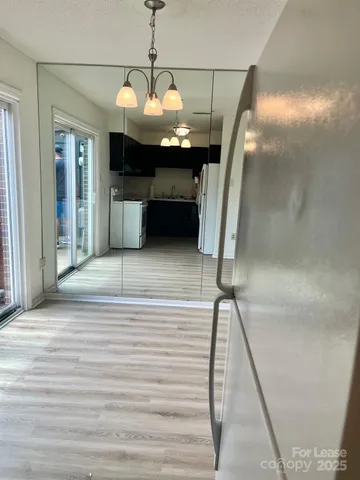 a view of a livingroom with a furniture wooden floor and window