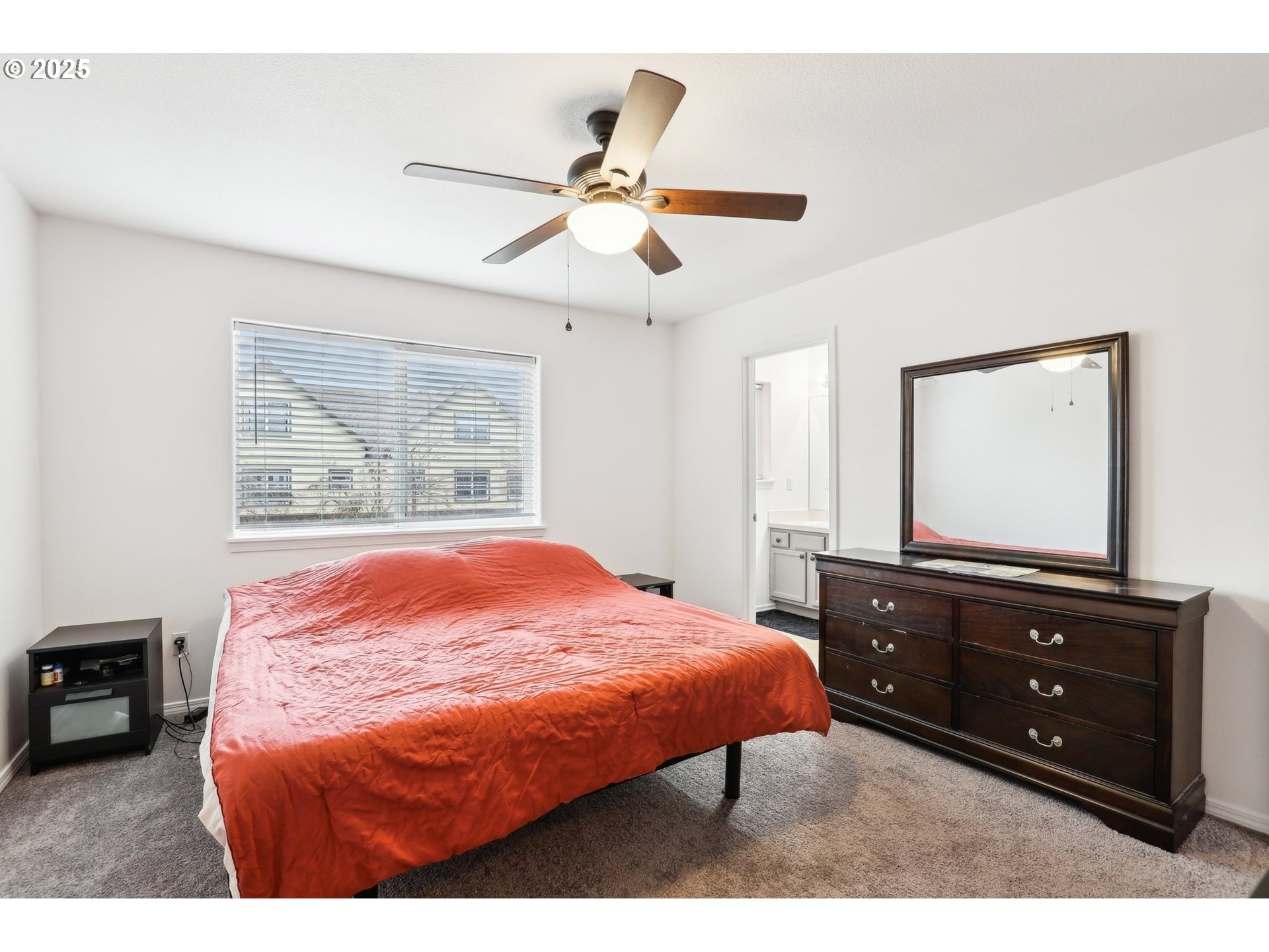 19153 Southeast Yamhill Street, Unit 21 Portland, OR 97233 - Photo 14 of 22 a bedroom with a bed and a dresser