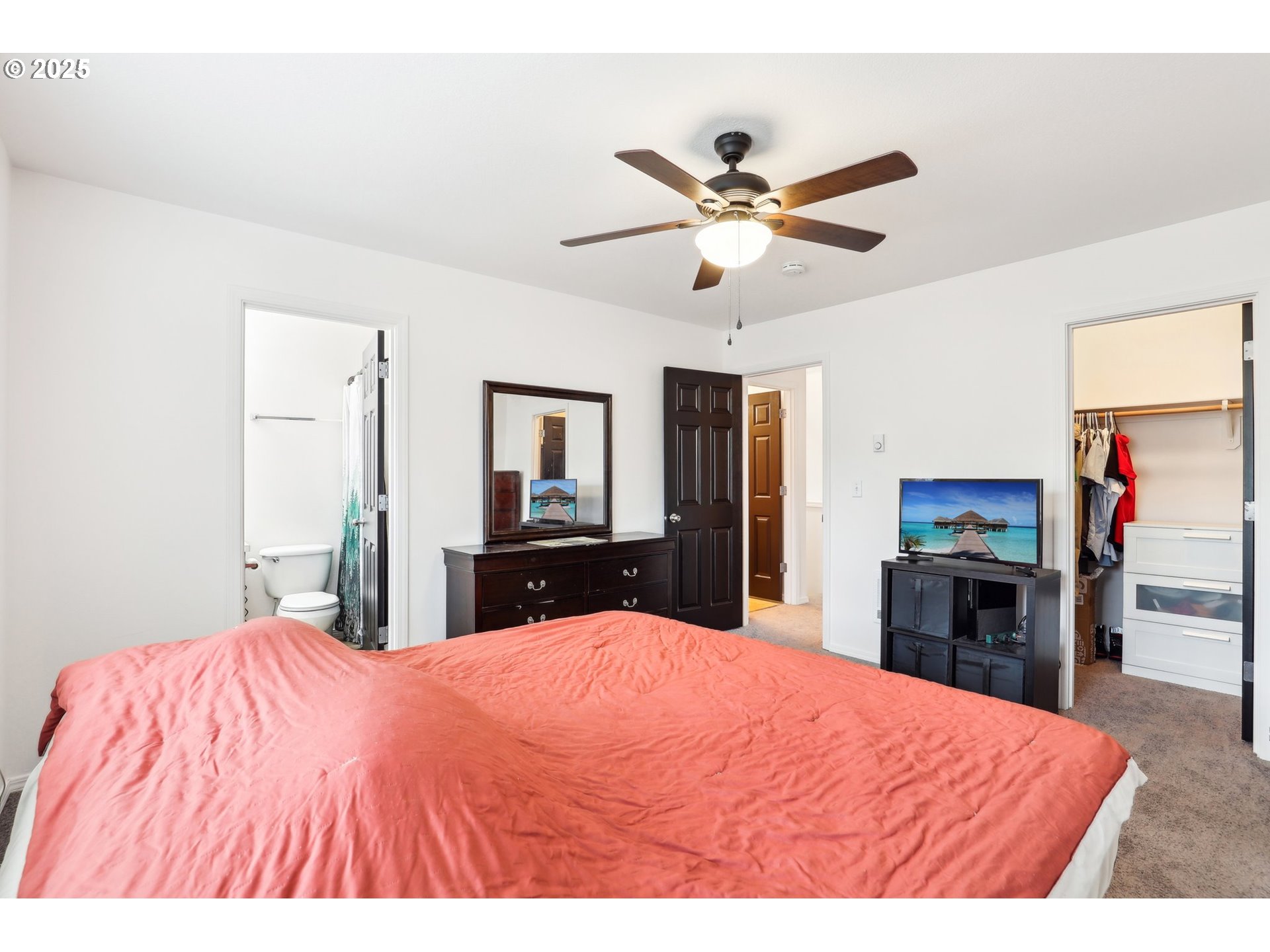19153 Southeast Yamhill Street, Unit 21 Portland, OR 97233 - Photo 15 of 22 a bed room with a bed and a mirror