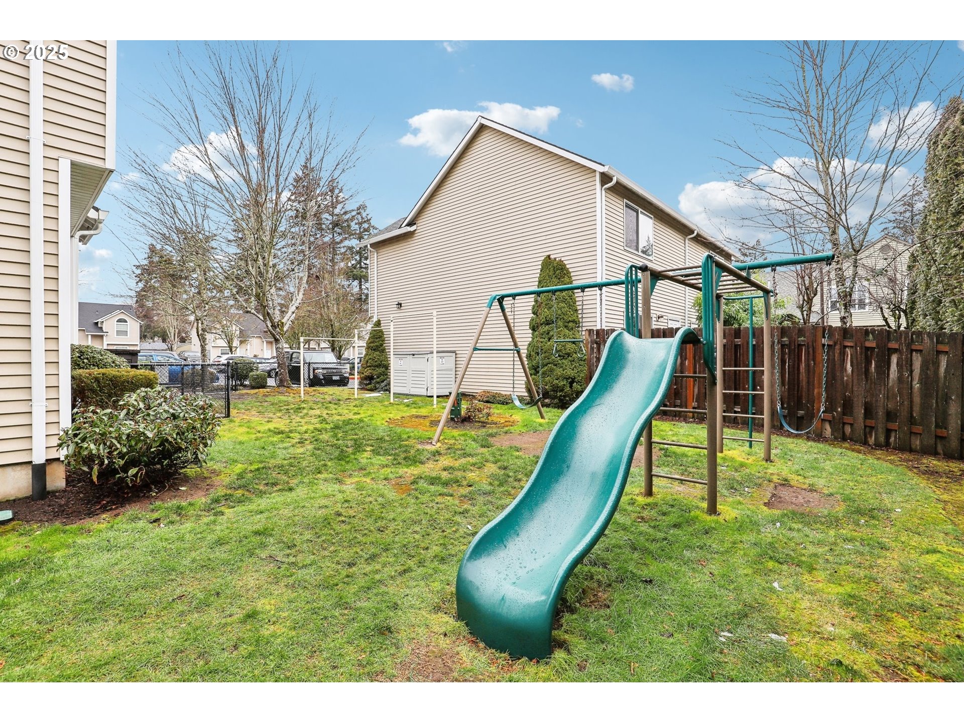 19153 Southeast Yamhill Street, Unit 21 Portland, OR 97233 - Photo 22 of 22 a view of a backyard with a slide