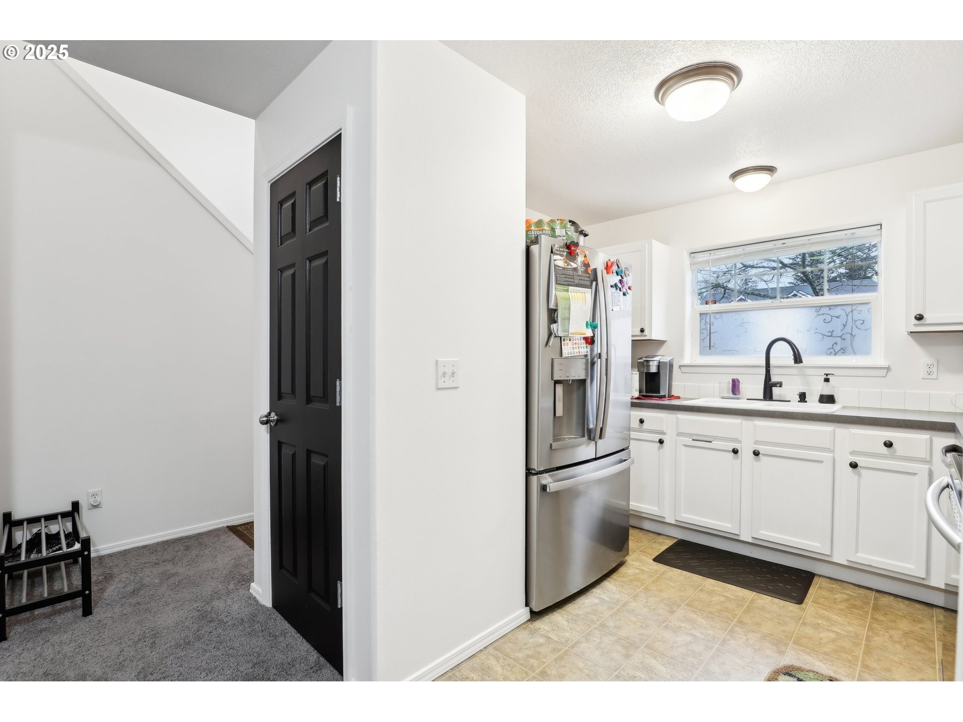 19153 Southeast Yamhill Street, Unit 21 Portland, OR 97233 - Photo 7 of 22 a kitchen with stainless steel appliances granite countertop a refrigerator and a sink