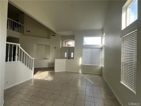 a view of a hallway view with staircase