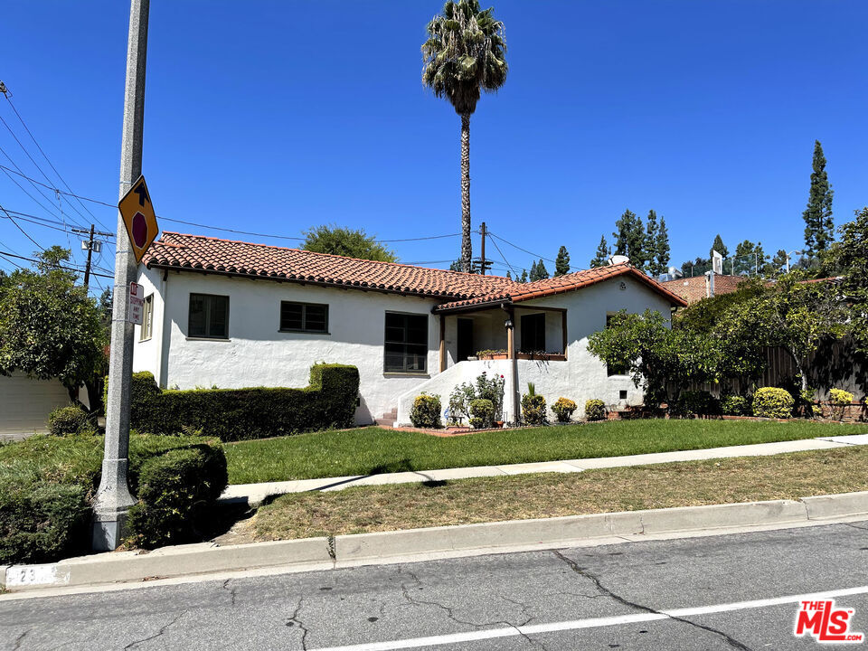 23 Melrose Avenue Pasadena, CA 91105 - Photo 2 of 15 a front view of a house with a yard and potted plants