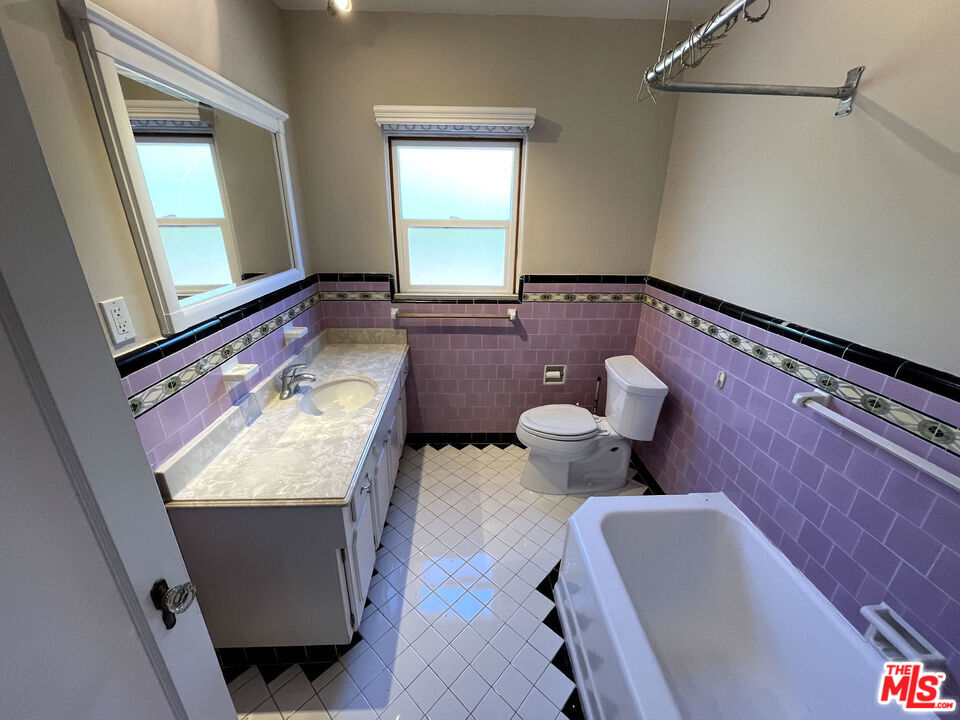 23 Melrose Avenue Pasadena, CA 91105 - Photo 8 of 15 a bathroom with a sink mirror and bathtub