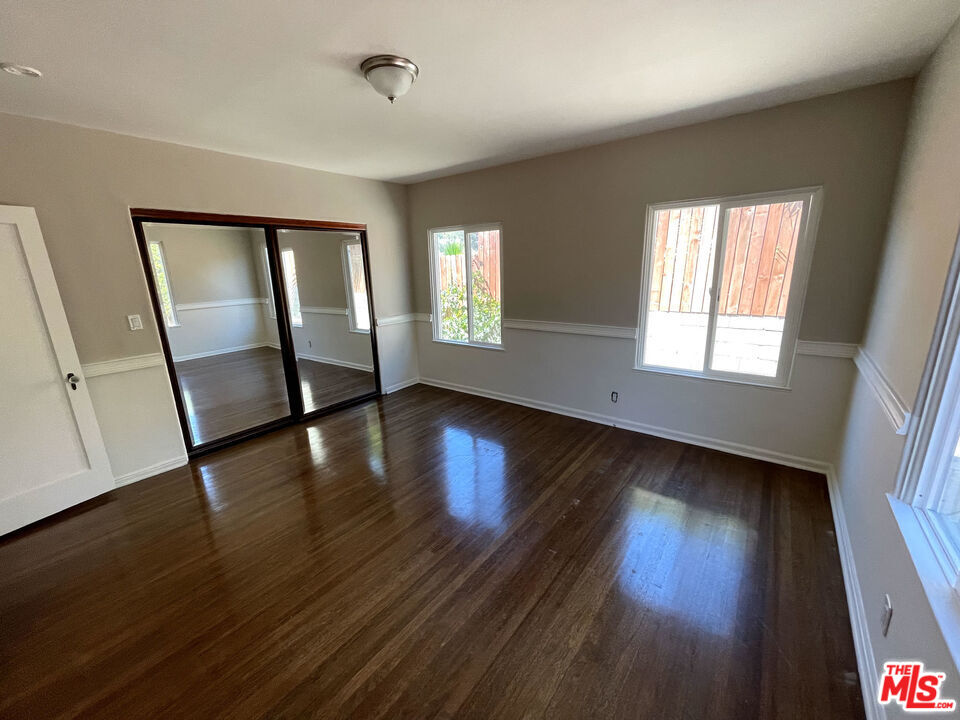 23 Melrose Avenue Pasadena, CA 91105 - Photo 9 of 15 a view of an empty room with wooden floor and a window