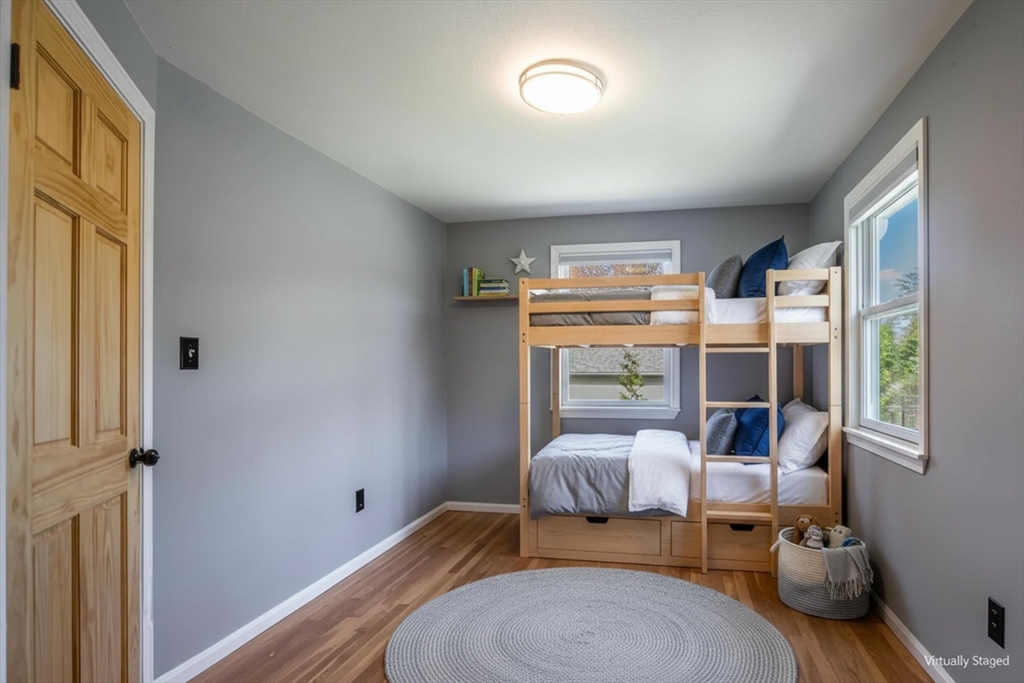 196 Center Street Groveland, MA 01834 - Photo 20 of 32 a bedroom with furniture and a large window