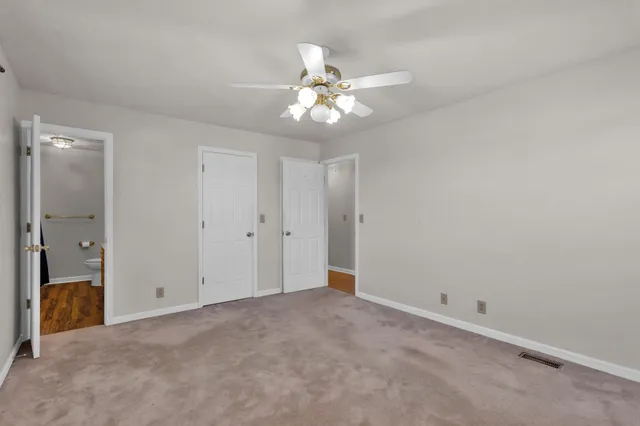 a view of an empty room and window