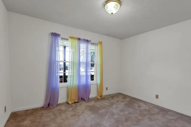 an empty room with window