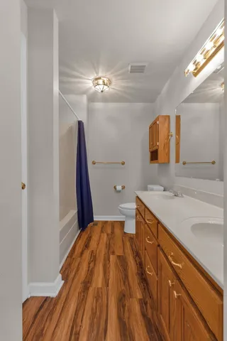 a spacious bathroom with a sink a mirror and vanity