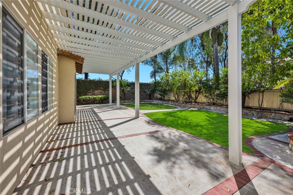 24 Pheasant Creek Irvine, CA 92618 - Photo 31 of 43 a view of a porch with wooden floor and fence