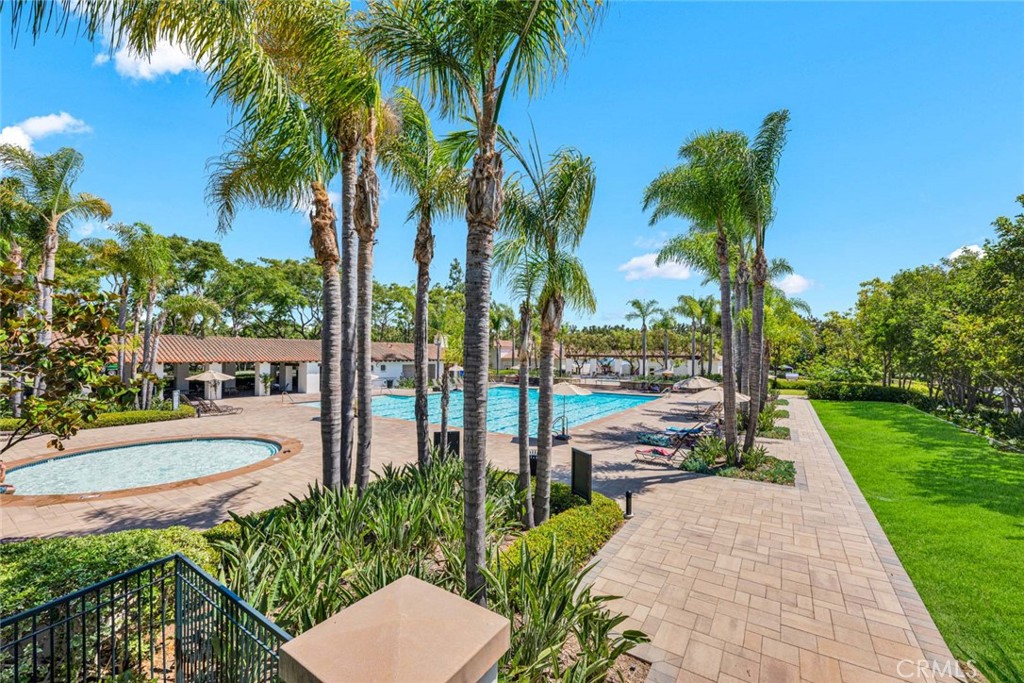 24 Pheasant Creek Irvine, CA 92618 - Photo 34 of 43 a view of a backyard with potted plants and palm trees