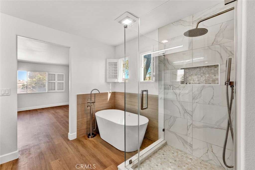 24 Pheasant Creek Irvine, CA 92618 - Photo 9 of 43 a living room with furniture and a chandelier