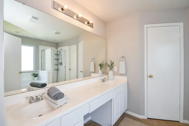 a bathroom with a bathtub and a shower